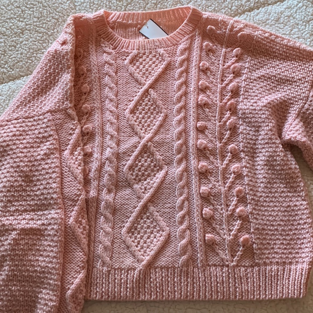 A long sleeve shirt sweater